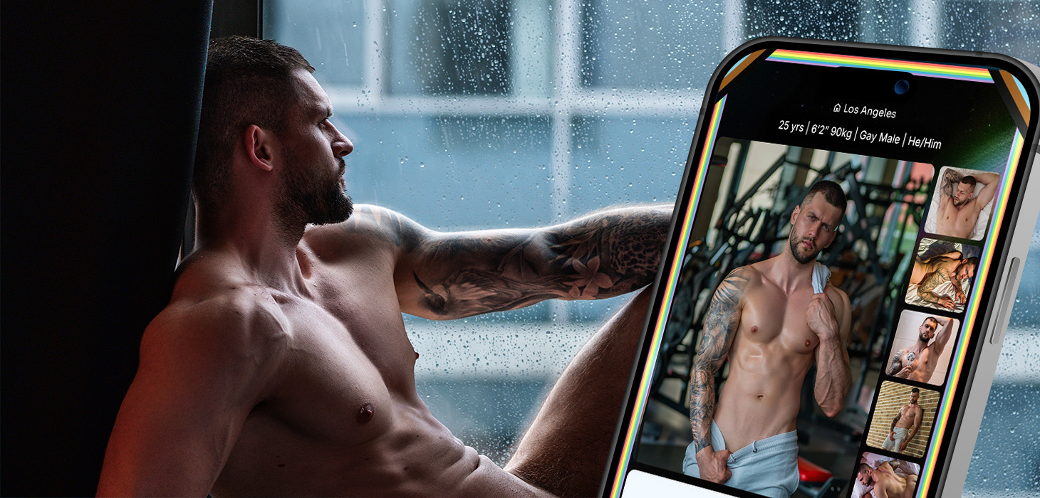 Side profile of a tattooed, shirtless man resting by a rain-speckled window, with a large smartphone showing a dating app gallery beside him.